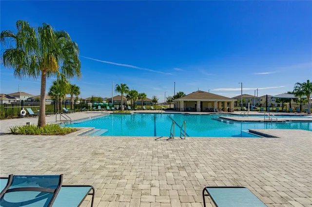 a view of a lake with a house in the background