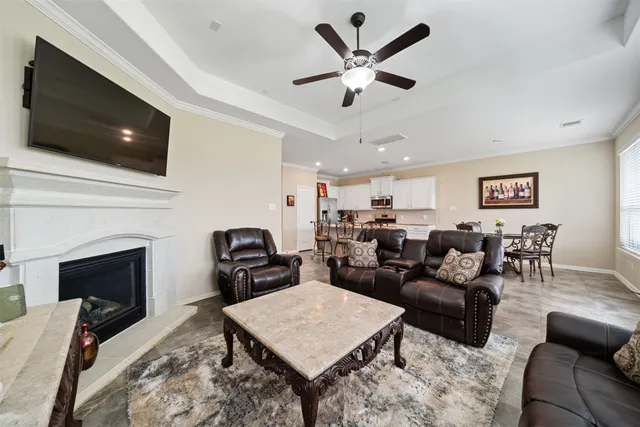 a bathroom with a granite countertop sink a mirror and shower