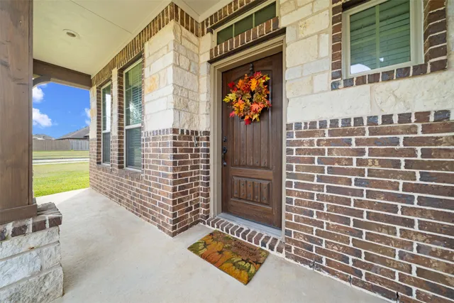 a view of a dining room with furniture and window