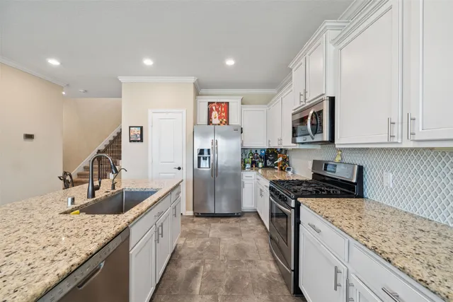 a view of a dining room with furniture and window