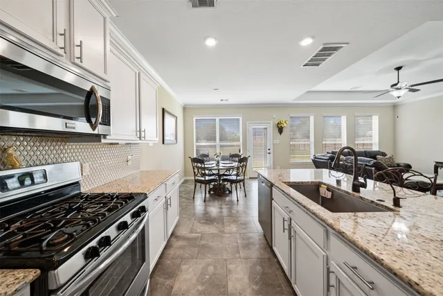 a bedroom with a bed dresser and a window