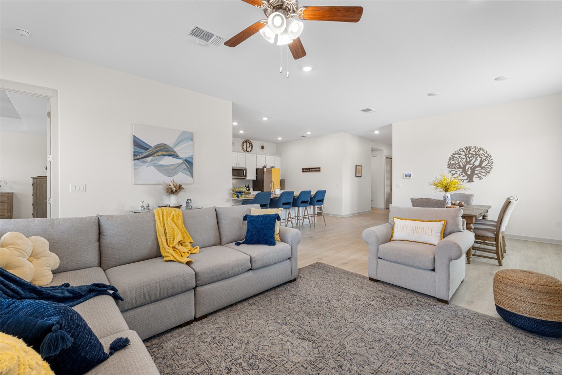 109 Rambling Rapids Drive Georgetown, TX 78628 - Photo 19 of 37 Living area with light wood-style floors, recessed lighting, and a ceiling fan