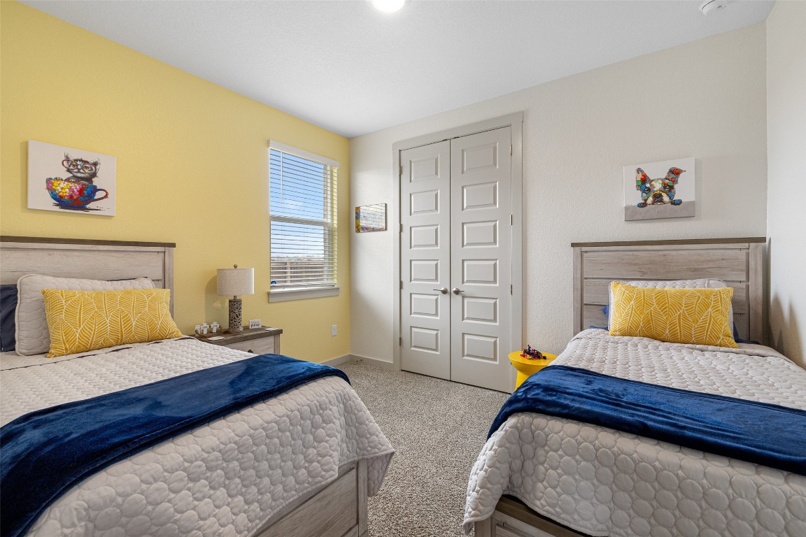 109 Rambling Rapids Drive Georgetown, TX 78628 - Photo 25 of 37 Carpeted bedroom featuring a closet and baseboards