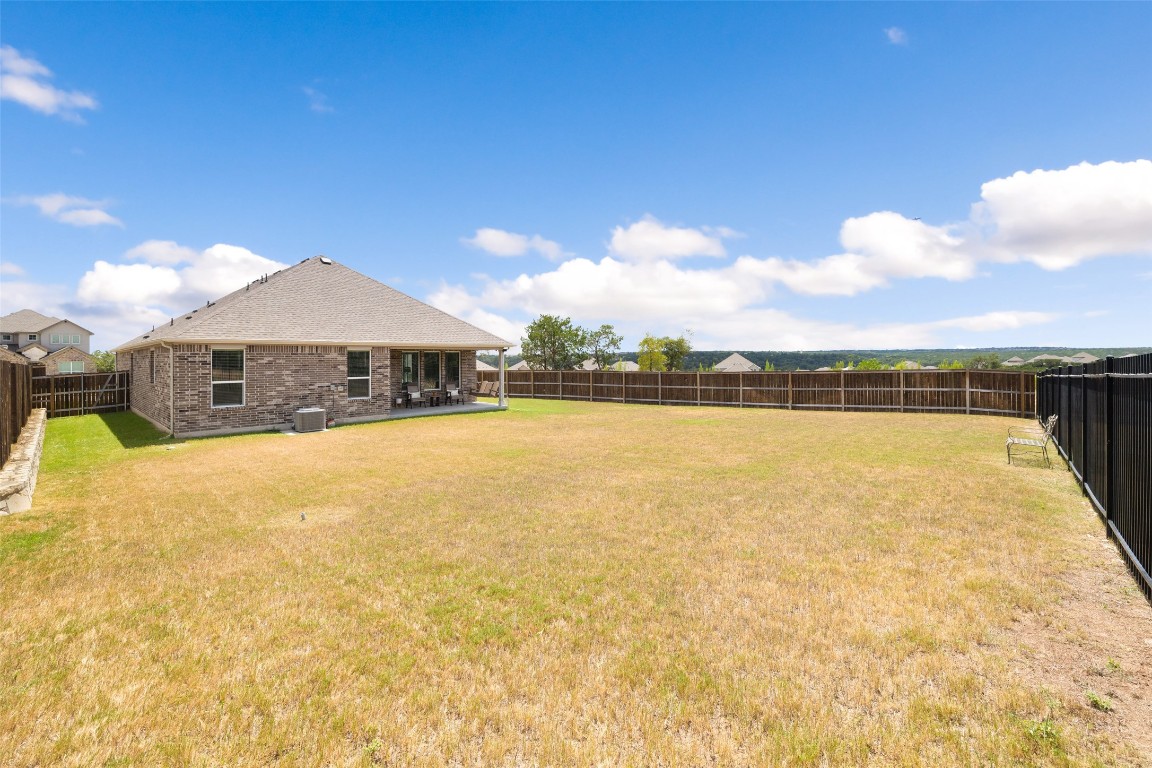 109 Rambling Rapids Drive Georgetown, TX 78628 - Photo 31 of 37 Fenced backyard featuring a patio area