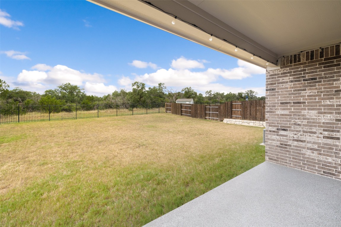109 Rambling Rapids Drive Georgetown, TX 78628 - Photo 35 of 37 Fenced backyard featuring a patio