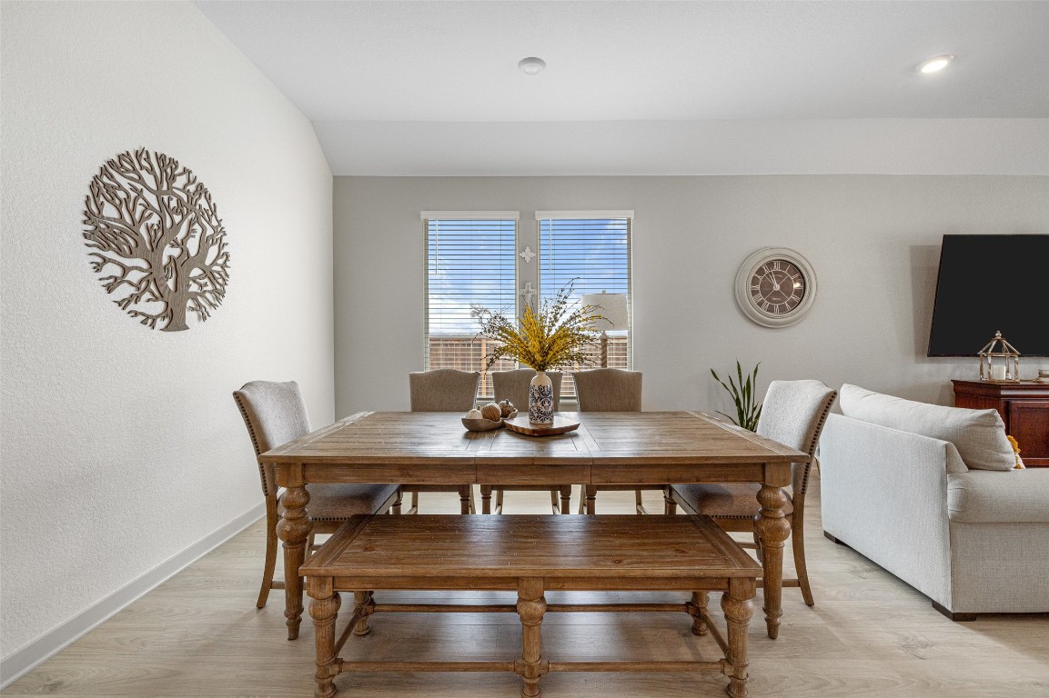 109 Rambling Rapids Drive Georgetown, TX 78628 - Photo 7 of 37 Dining space with light wood-style flooring and a textured wall
