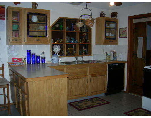 104 Osgood Road Sterling, MA 01564 - Photo 3 of 15 a kitchen with a sink and cabinets