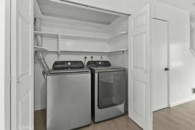 a close view of a utility room with washer and dryer