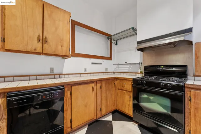 a living room with lots of furniture and a chandelier
