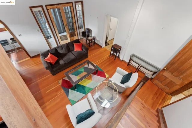 a view of a livingroom with a ceiling fan and window