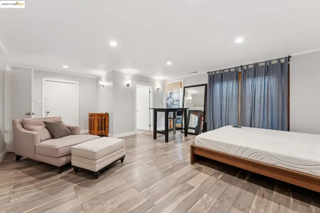 a view of a patio with iron fence