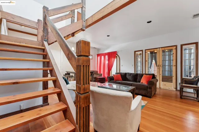 a view of a house with a yard and wooden fence