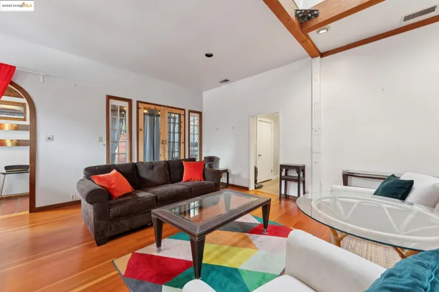 a spacious bedroom with a bed and a couch