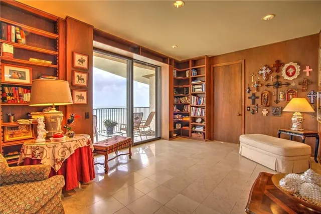 a spacious bathroom with a granite countertop sink and a large window