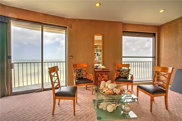 a kitchen with stainless steel appliances granite countertop a sink a refrigerator and cabinets