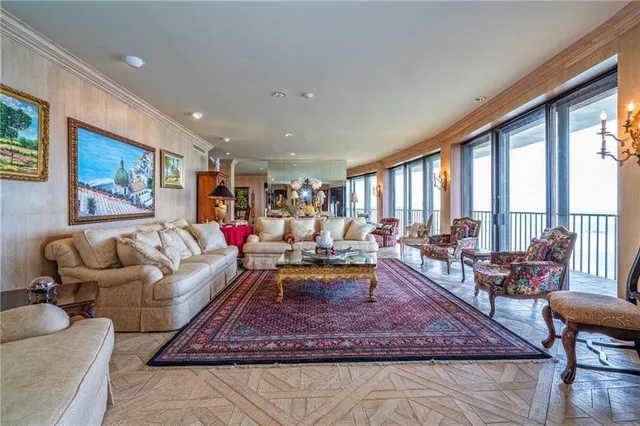 a view of a livingroom with furniture and a window