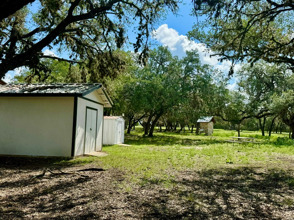 101 Patterson Drive Leakey, TX 78873 - Photo 8 of 18 a backyard of a house with a yard and outdoor seating