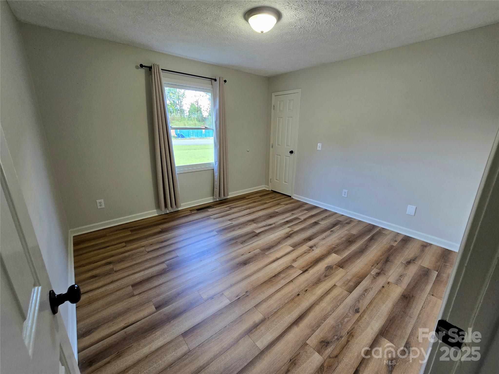 2363 Edna Street Catawba, NC 28609 - Photo 11 of 14 a view of a room with wooden floor and window