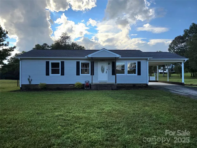 a backyard of a house with lots of green space