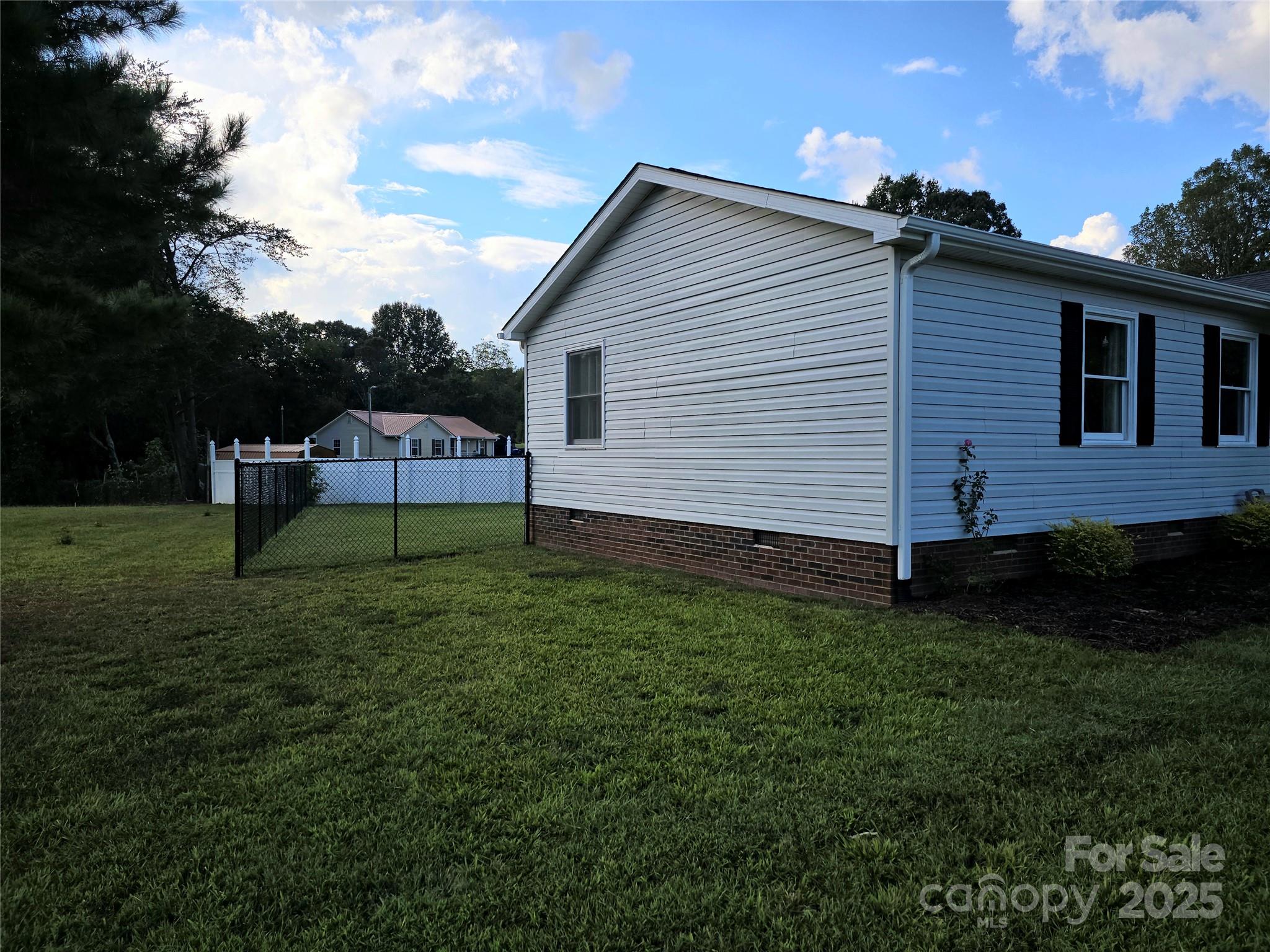 2363 Edna Street Catawba, NC 28609 - Photo 3 of 14 a backyard of a house with lots of green space and garden