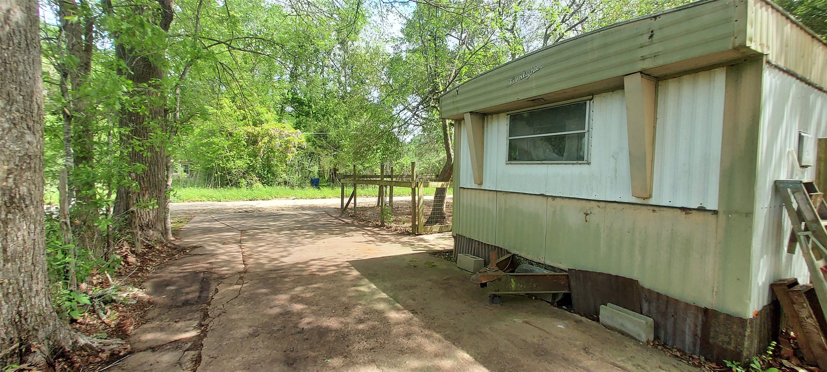 324 East Second Street Groveton, TX 75845 - Photo 16 of 20 a pathway of a house with a yard