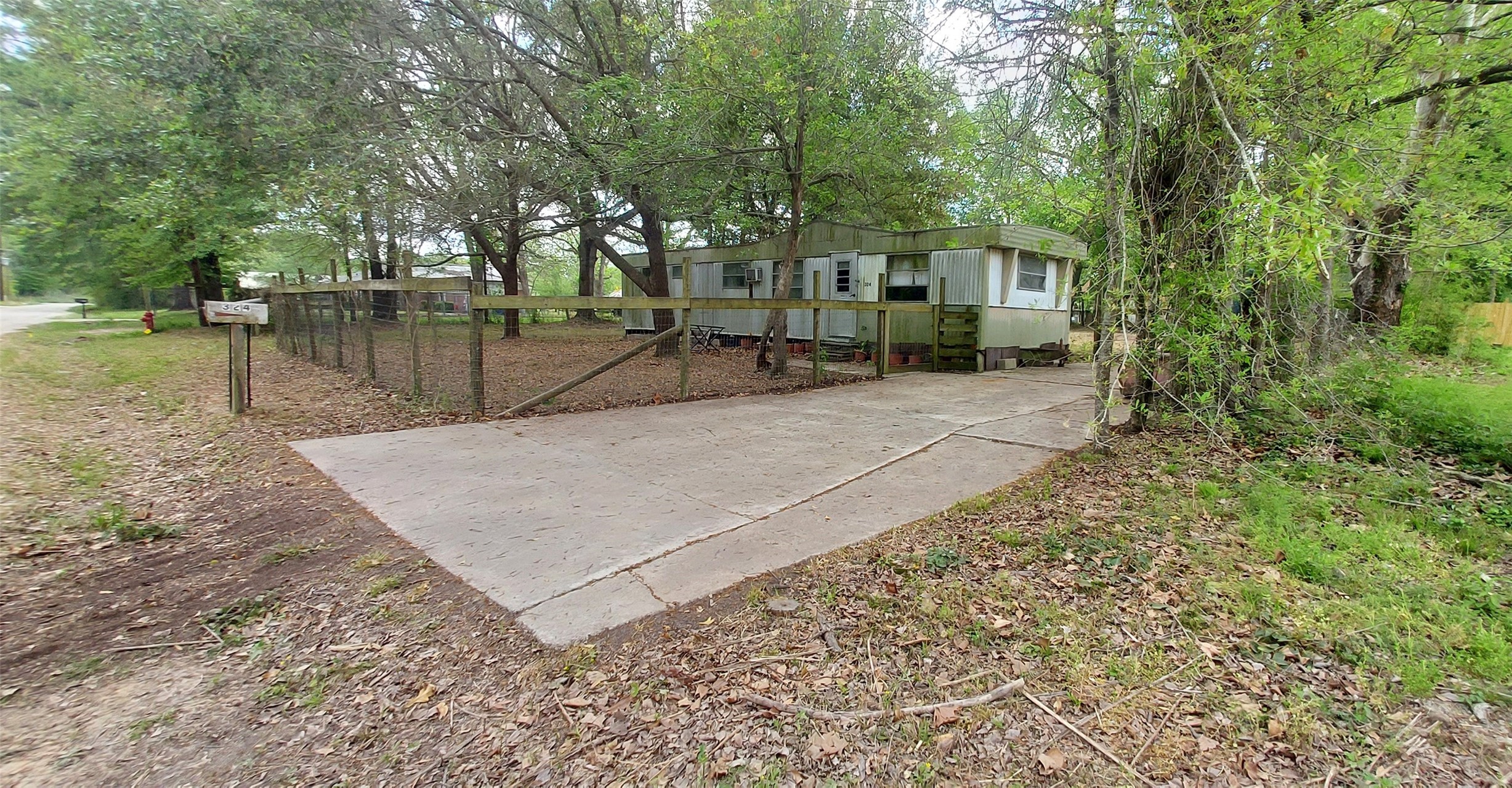 324 East Second Street Groveton, TX 75845 - Photo 17 of 20 a view of a house with a yard