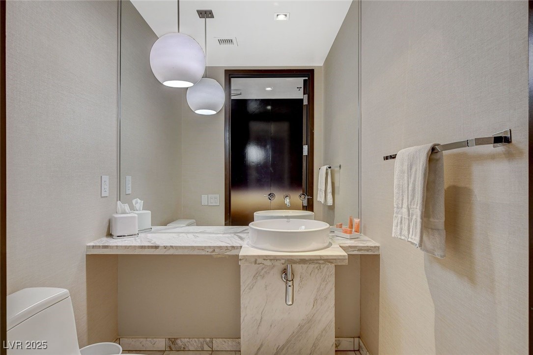 4381 West Flamingo Road, Unit 2202 Las Vegas, NV 89103 - Photo 27 of 40 Bathroom with a sink and tile patterned flooring