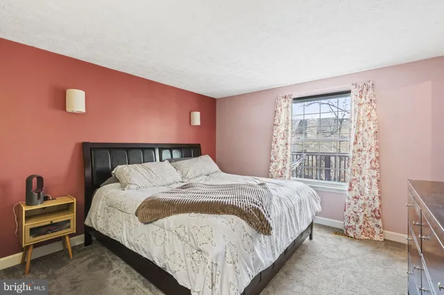 a picture of a bench in front of a wall