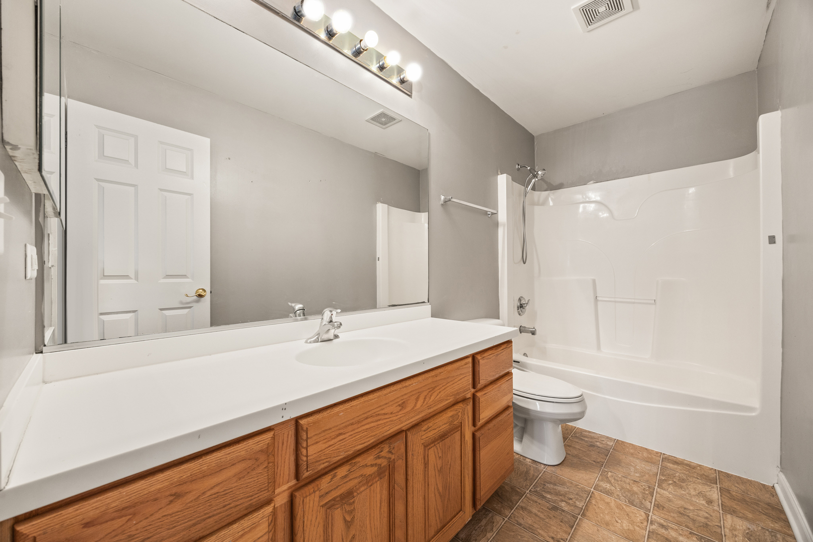 333 Claridge Circle Bolingbrook, IL 60440 - Photo 23 of 33 a bathroom with a sink toilet a mirror and shower