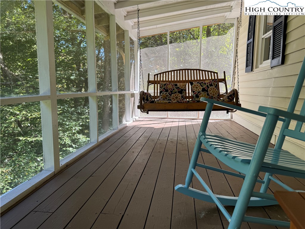 321 Skin Camp Creek Road Todd, NC 28684 - Photo 24 of 29 a view of a balcony with wooden floor