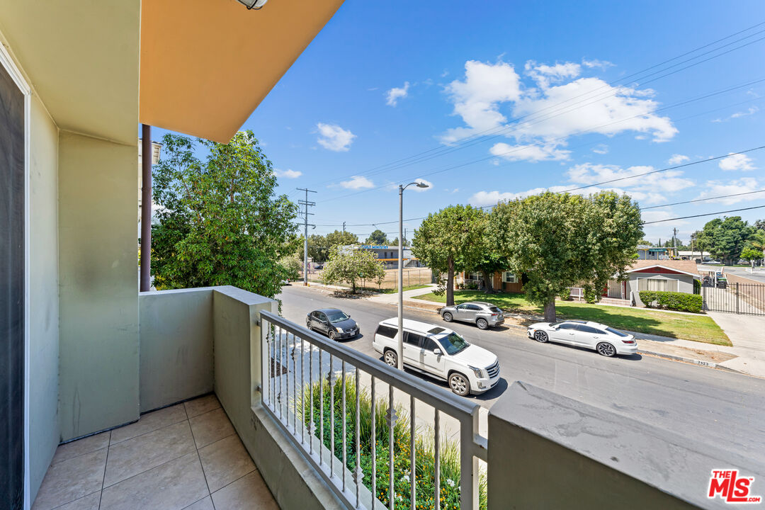 7122 Amigo Avenue Reseda, CA 91335 - Photo 8 of 16 a view of a balcony with couches and city view