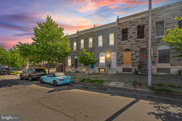 a view of a parked cars in front of a building