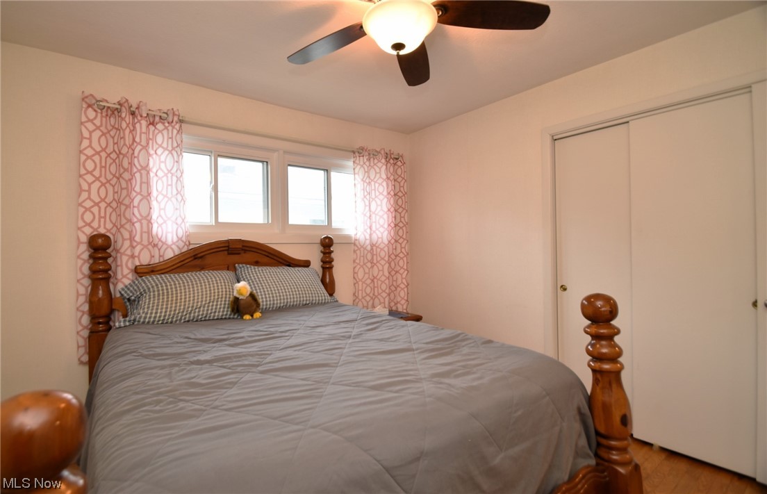 28740 Forest Road Willowick, OH 44095 - Photo 12 of 27 Hardwood floored bedroom with ceiling fan and a closet