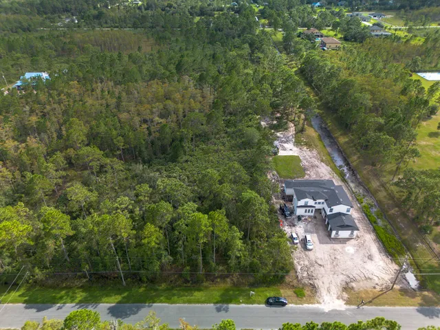 a aerial view of a house with a yard