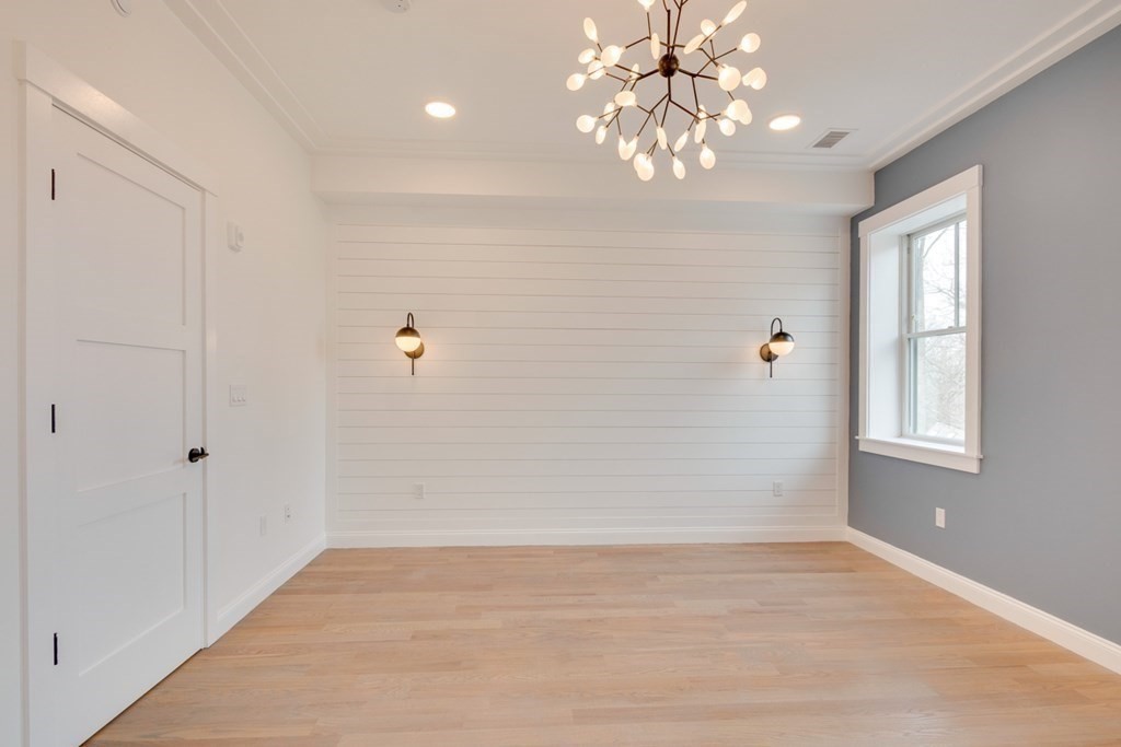 15 Euston Street, Unit 3 Brookline, MA 02446 - Photo 22 of 37 wooden floor in an empty room with a window