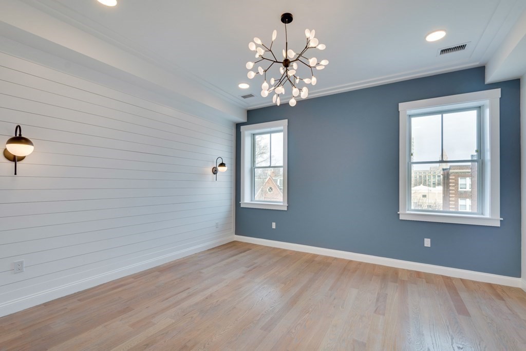 15 Euston Street, Unit 3 Brookline, MA 02446 - Photo 23 of 37 wooden floor in an empty room with a window