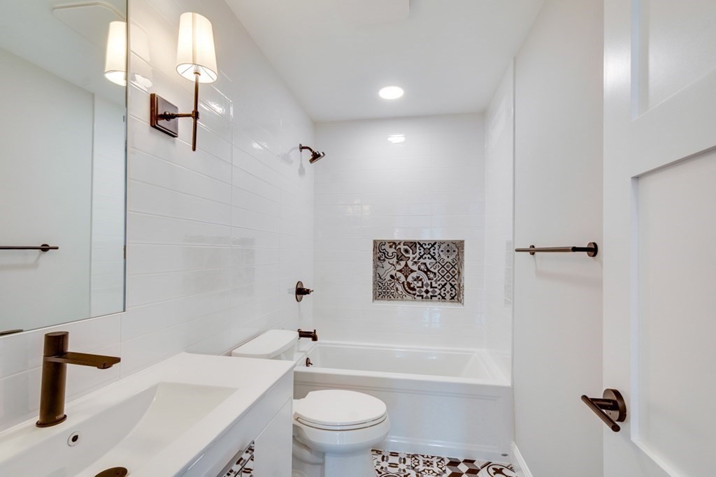 15 Euston Street, Unit 3 Brookline, MA 02446 - Photo 29 of 37 a bathroom with a sink a toilet and shower