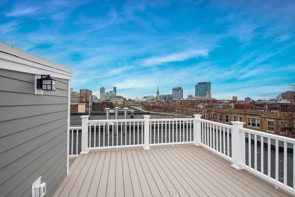 15 Euston Street, Unit 3 Brookline, MA 02446 - Photo 32 of 37 a view of a roof with wooden floor and city view
