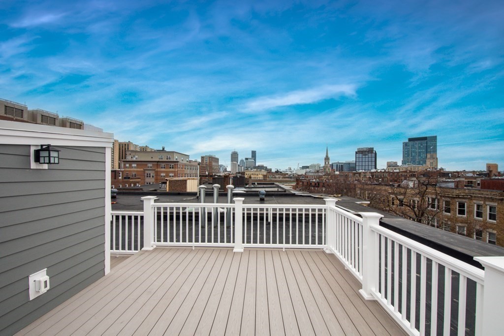 15 Euston Street, Unit 3 Brookline, MA 02446 - Photo 34 of 37 a view of a balcony with wooden floor