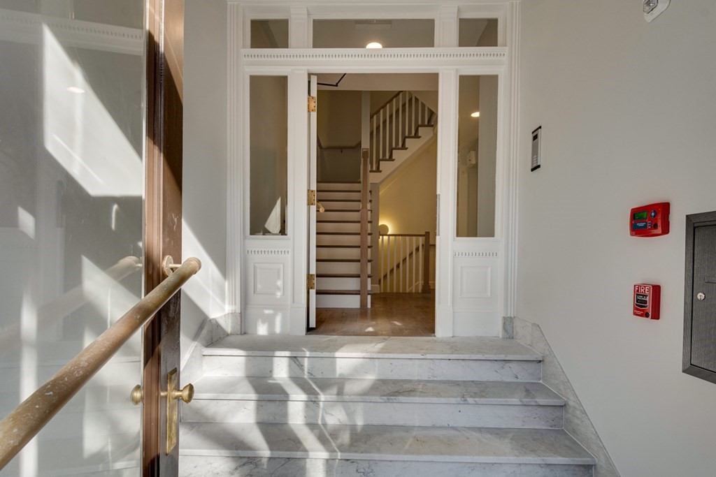 15 Euston Street, Unit 3 Brookline, MA 02446 - Photo 5 of 37 a view of staircase with white walls and windows
