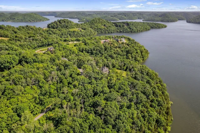 a view of a lake with a house in the background