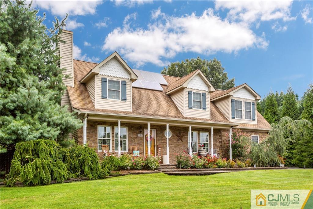 7 Country Road Jackson, NJ 08527 - Photo 1 of 44 a front view of a house with a yard