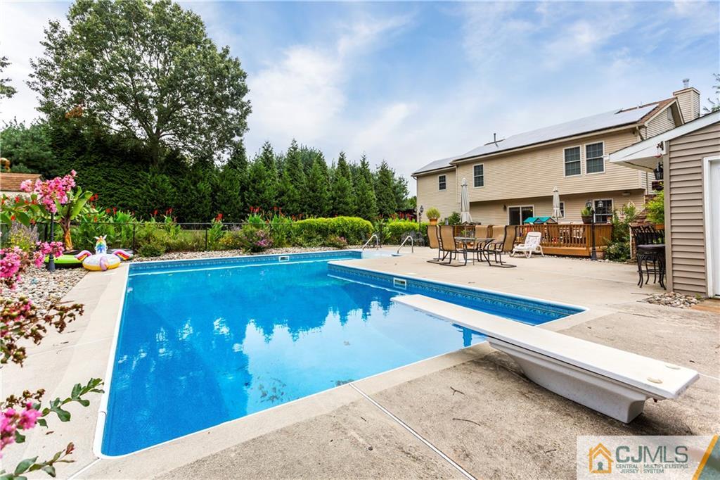 7 Country Road Jackson, NJ 08527 - Photo 44 of 44 a view of a swimming pool with an outdoor seating