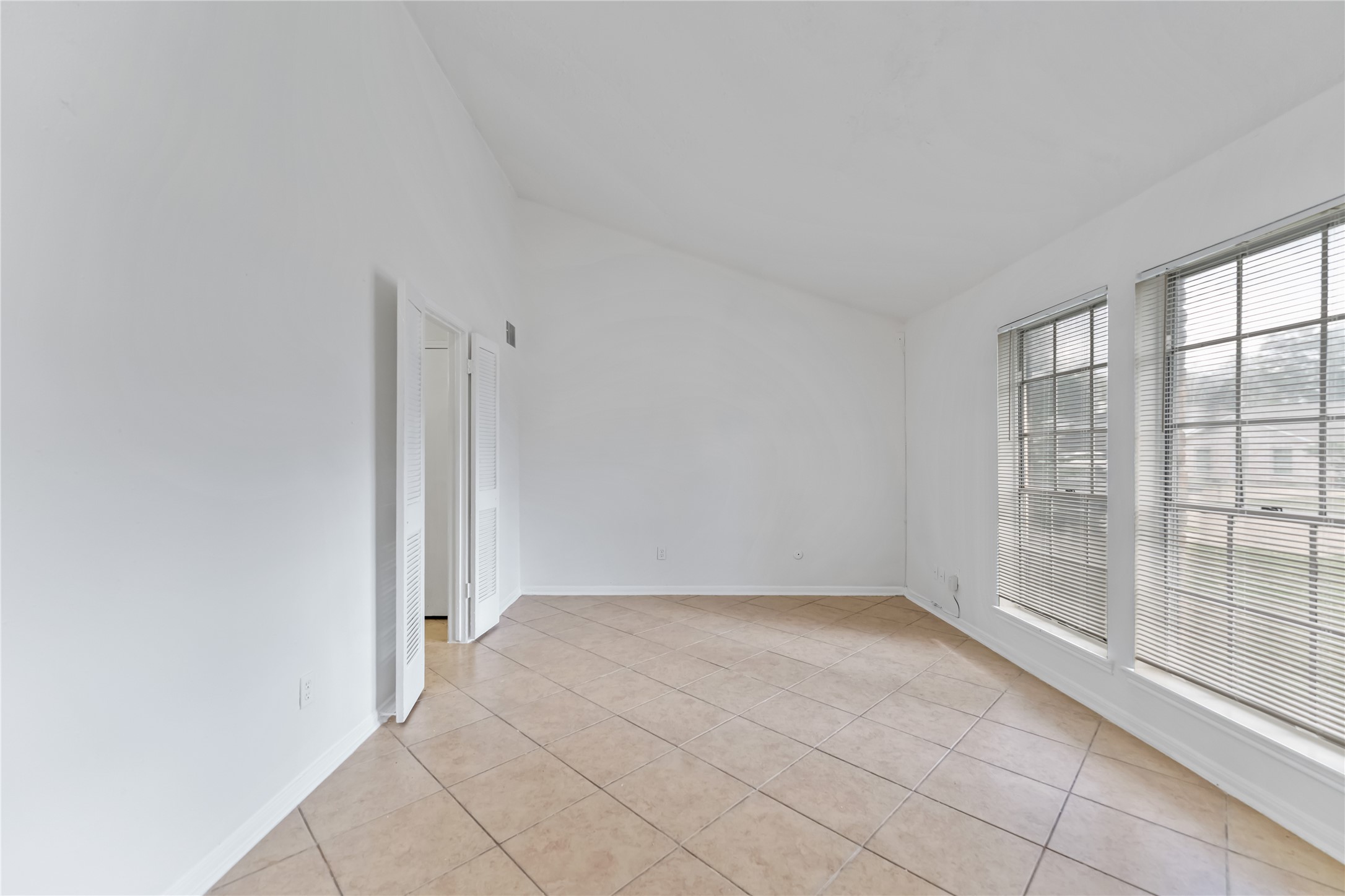 4927 Glendower Drive Spring, TX 77373 - Photo 11 of 22 wooden floor in an empty room with a window