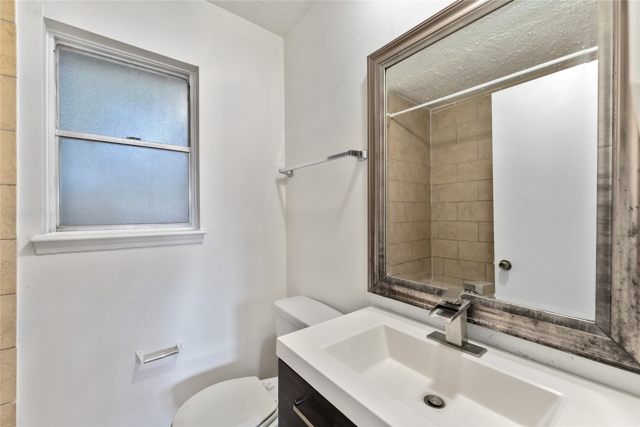 4927 Glendower Drive Spring, TX 77373 - Photo 15 of 22 a bathroom with a sink and a mirror