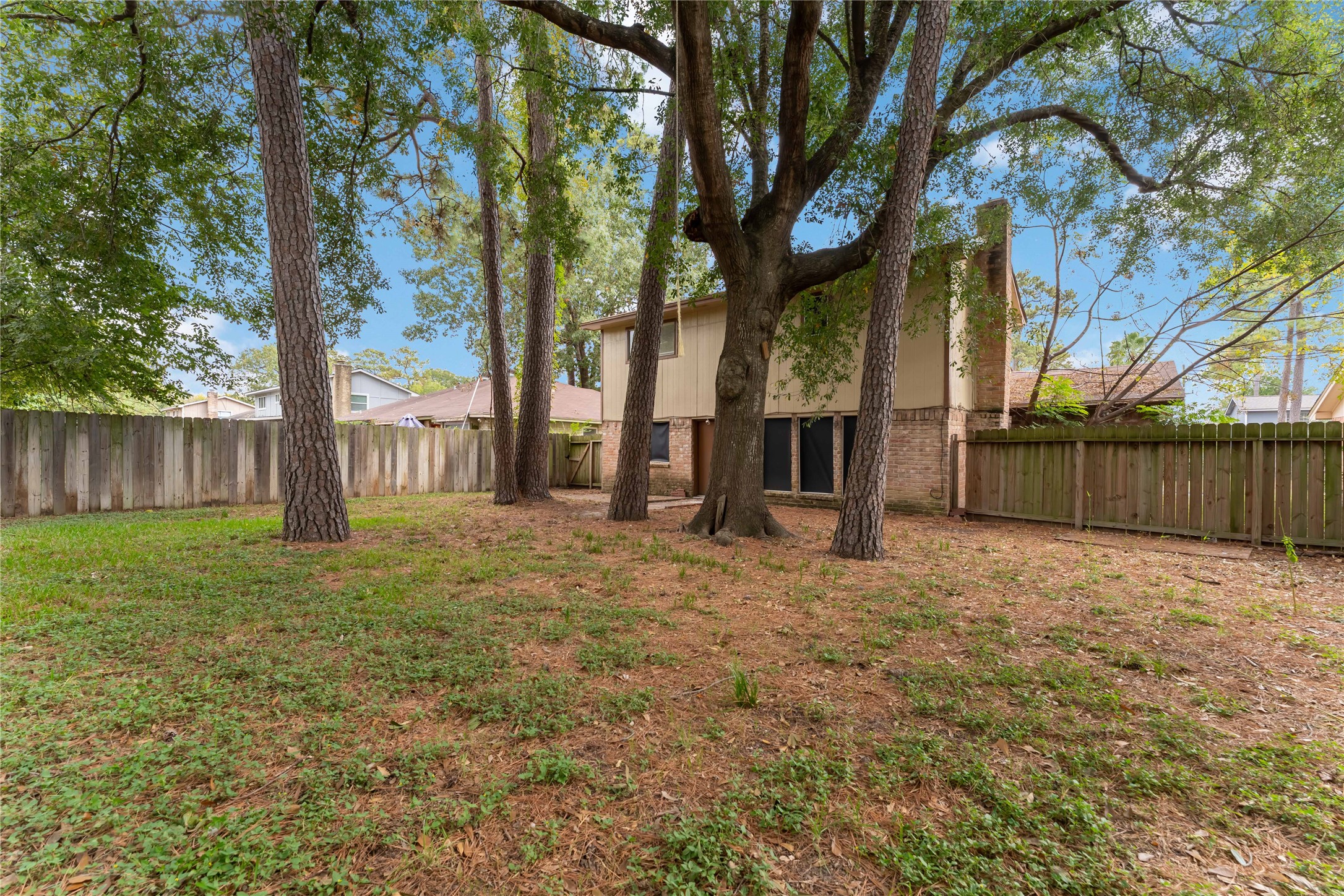 4927 Glendower Drive Spring, TX 77373 - Photo 22 of 22 a view of a yard with wooden fence