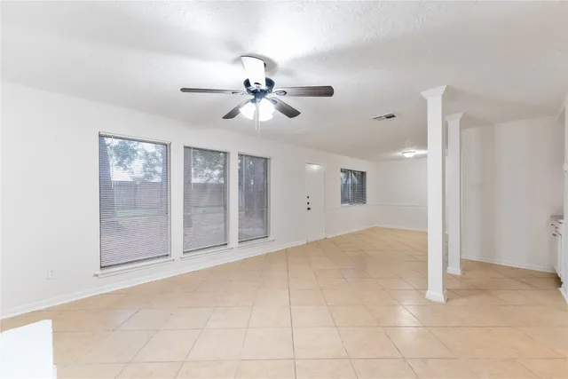 a view of empty room with windows