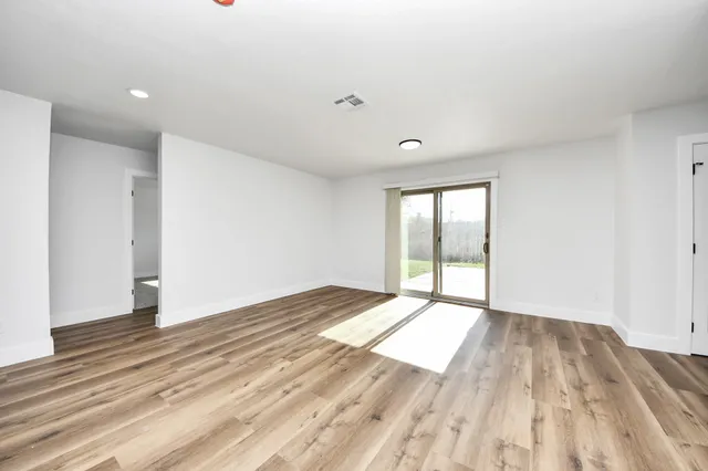 a view of an empty room and window