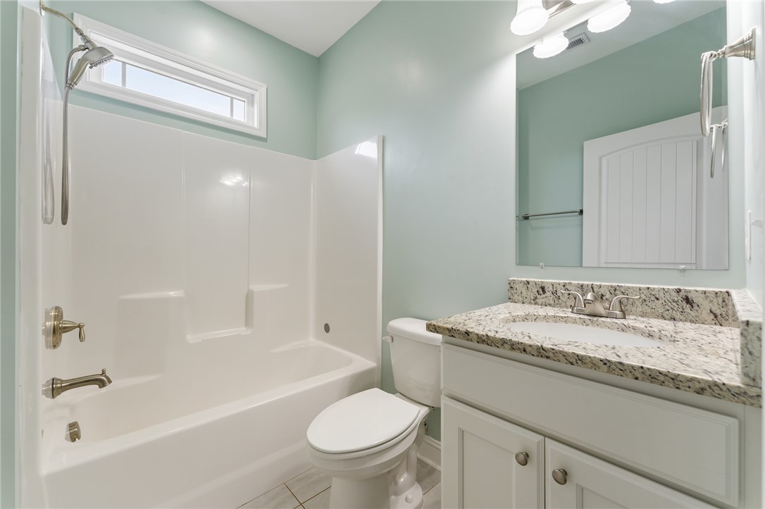 1411 Dunn Road Anderson, SC 29625 - Photo 22 of 30 This bathroom features a sleek vanity and a tub shower combination.