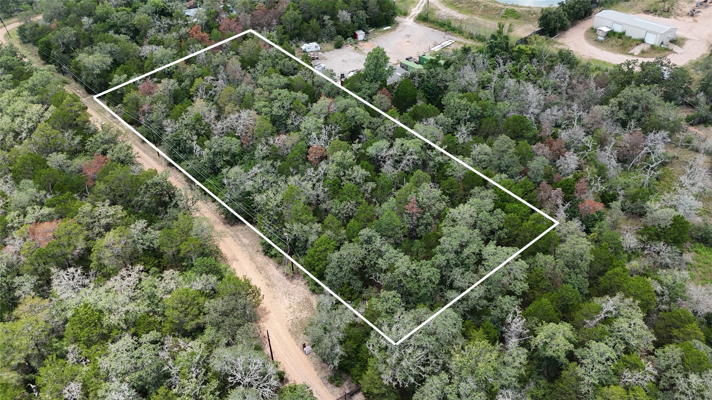 Tbd Red Fox Lane Bastrop, TX 78602 - Photo 2 of 14 A secluded, wooded lot awaits, offering a private escape nestled among mature trees.
